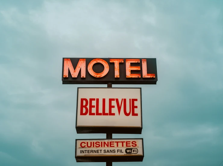 a motel sign next to some motel's outside