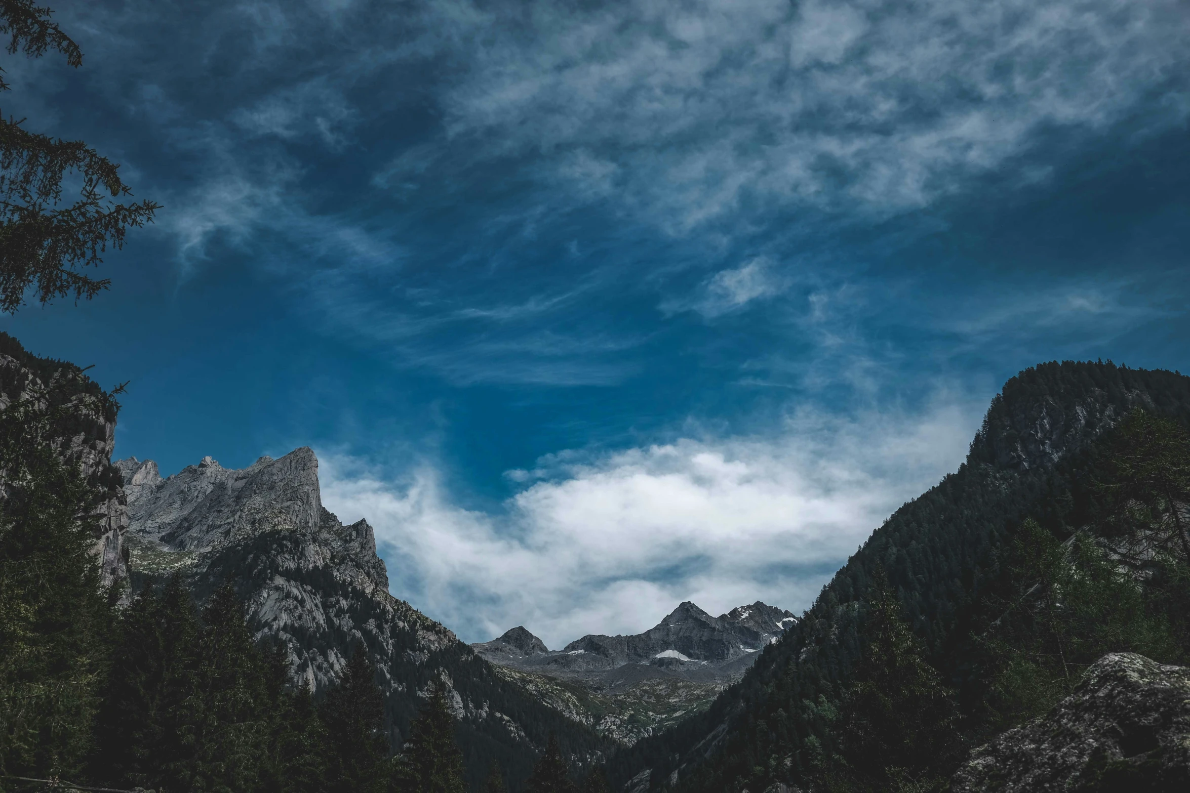 a large mountain that is next to some trees