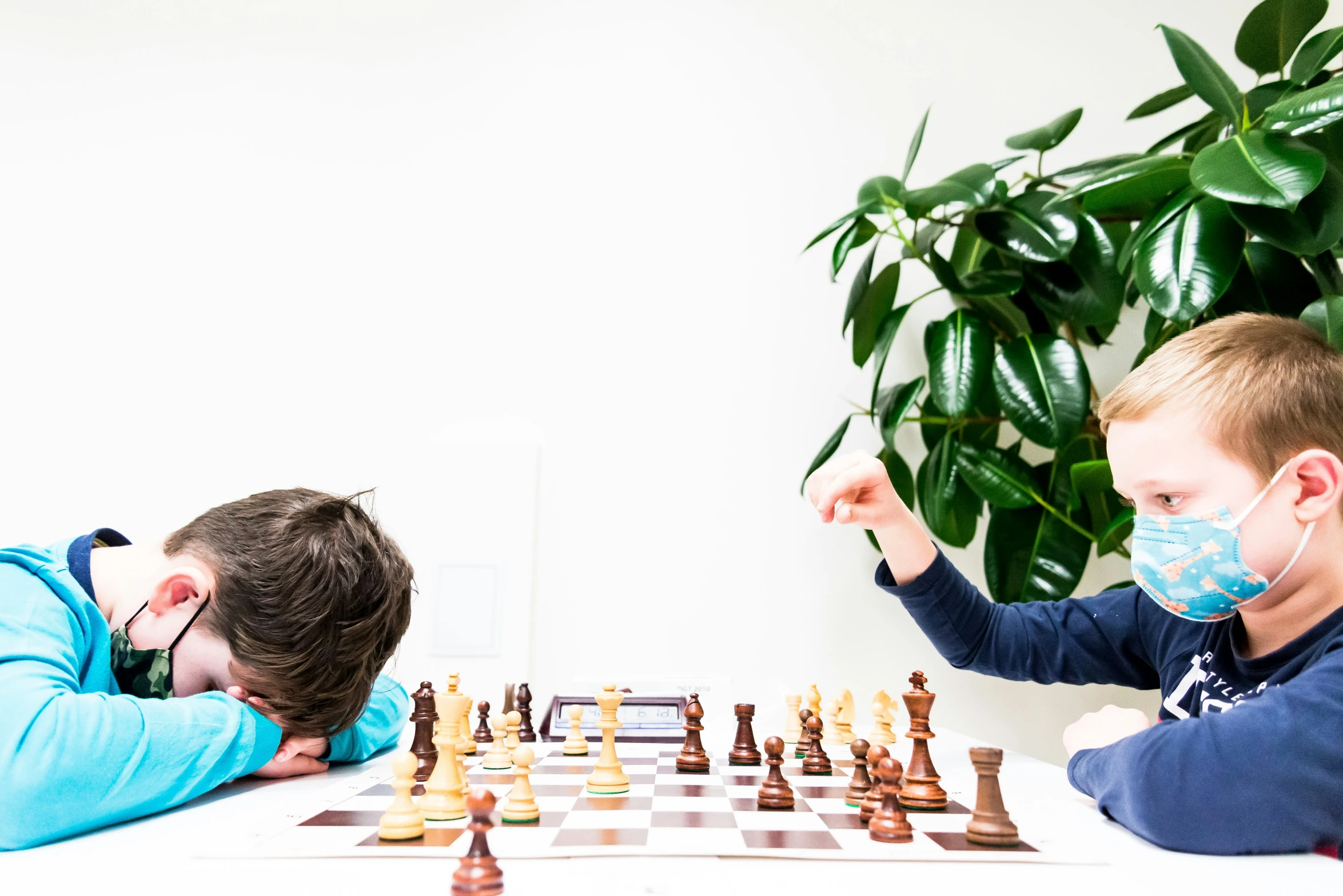 two s playing a game of chess together