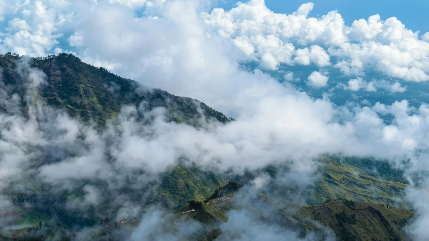 the view from an airplane shows the surrounding mountain tops