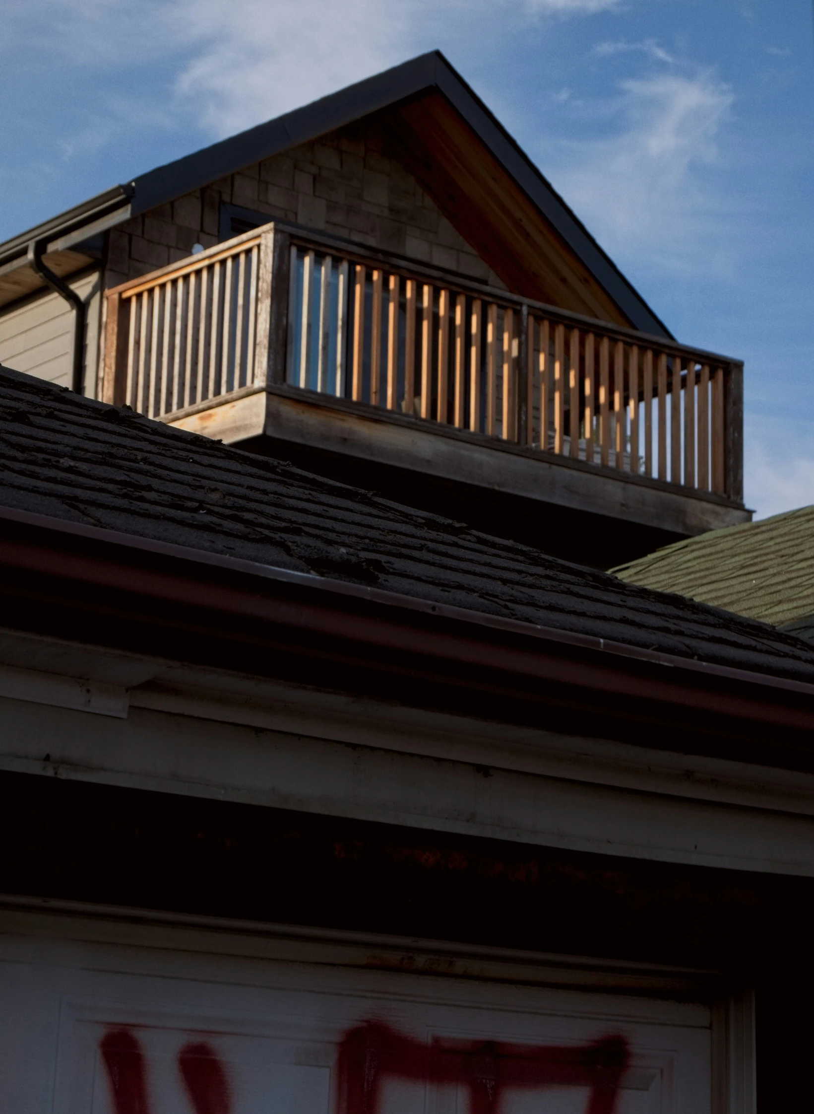 the roof of a house with graffiti on it