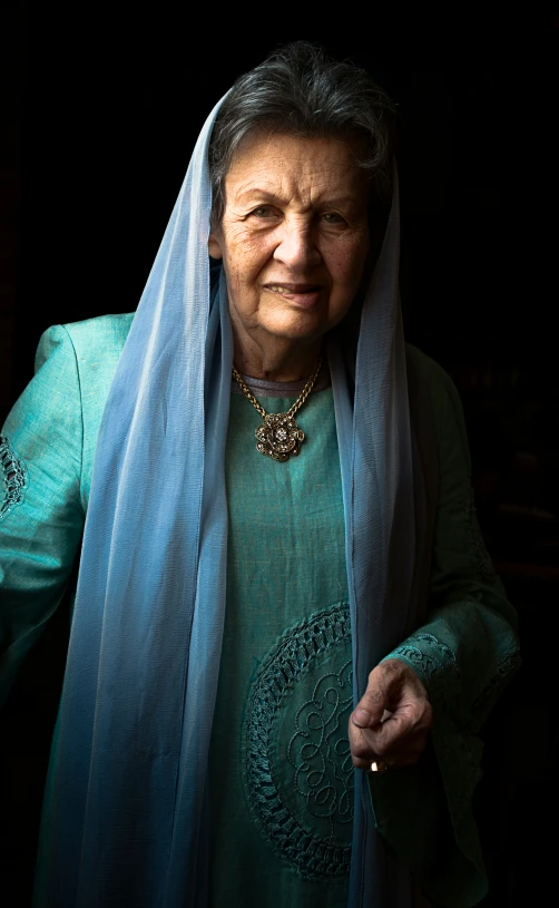 a woman wearing a veil in the dark