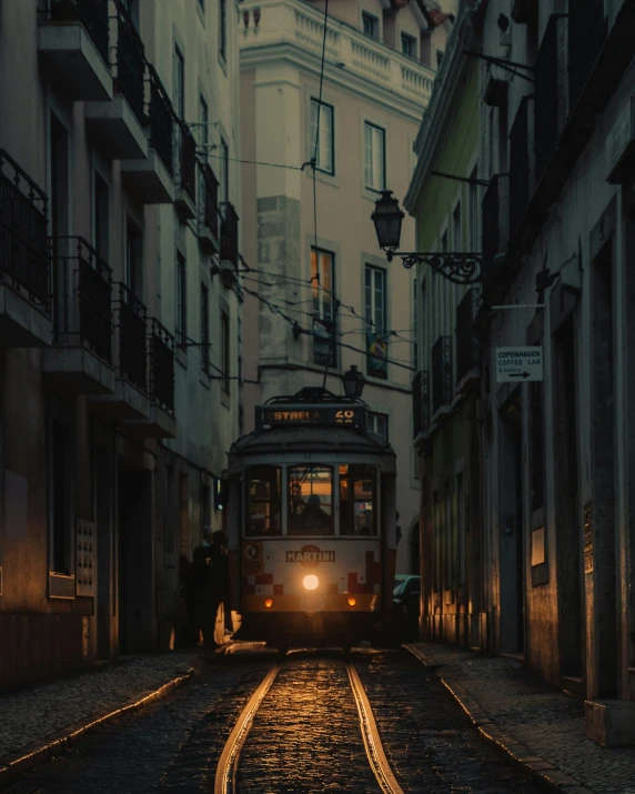 a trolley in the city street with building in the background