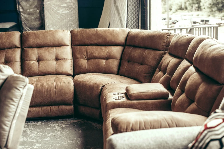 this sectional sofa is shown with two reclining chairs