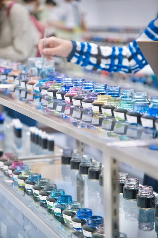 a store shelf that contains many small jars