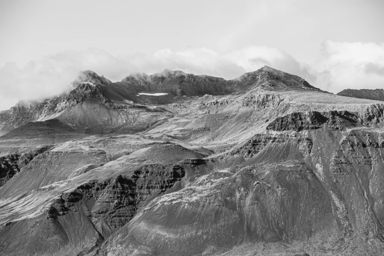 black and white pograph of snow covered mountains