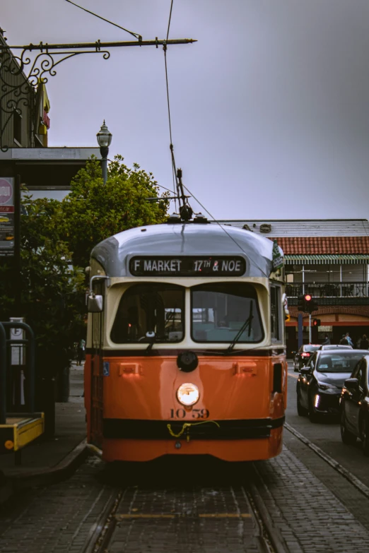 a tram is passing through the busy city center