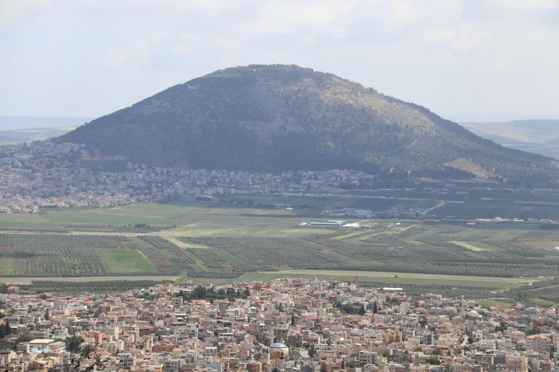 an overview view of a city near a large mountain