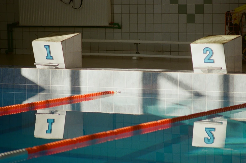 an outdoor pool with lanes in the middle