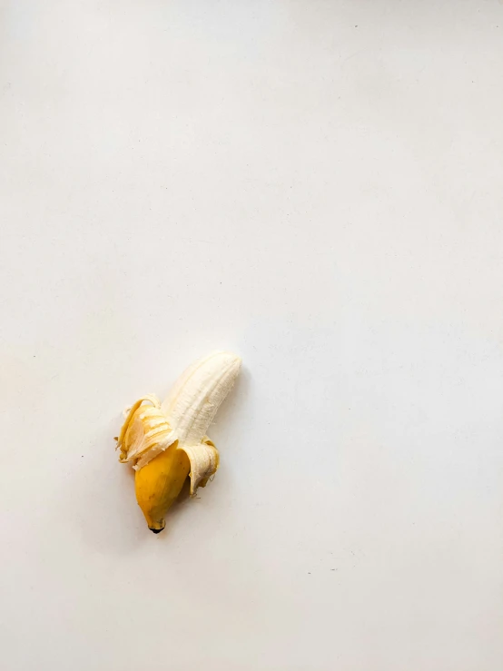 a peeled banana is sitting on a table