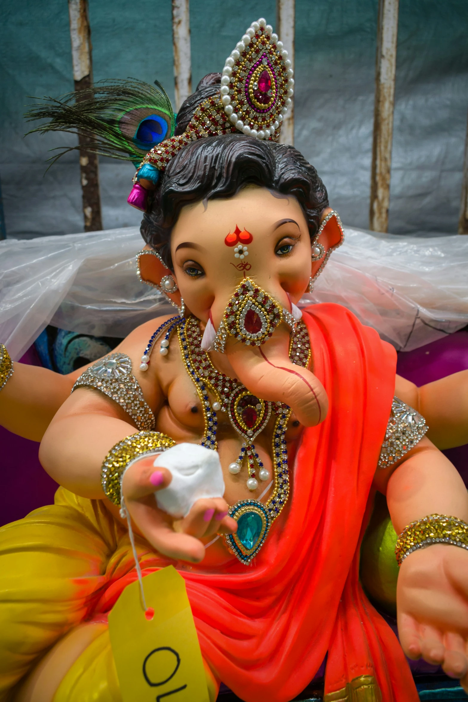 a statue of an indian woman holding a creamer