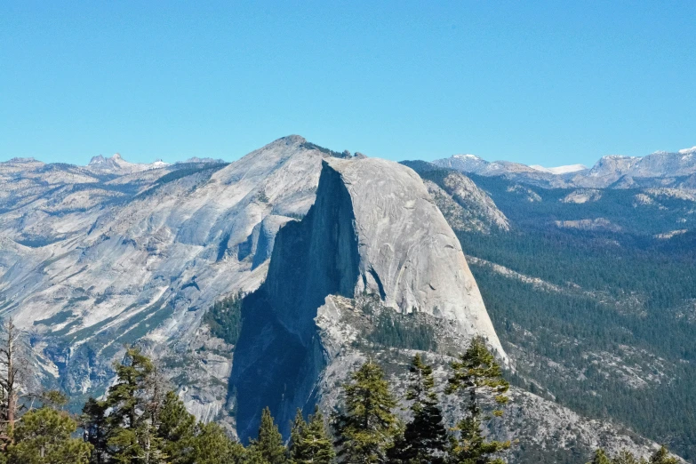 a huge cliff that has some trees in it