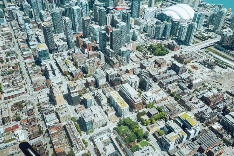 aerial view of city skyline from airplane with ocean and sky in background