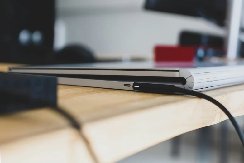 a close up of a laptop on a wooden table