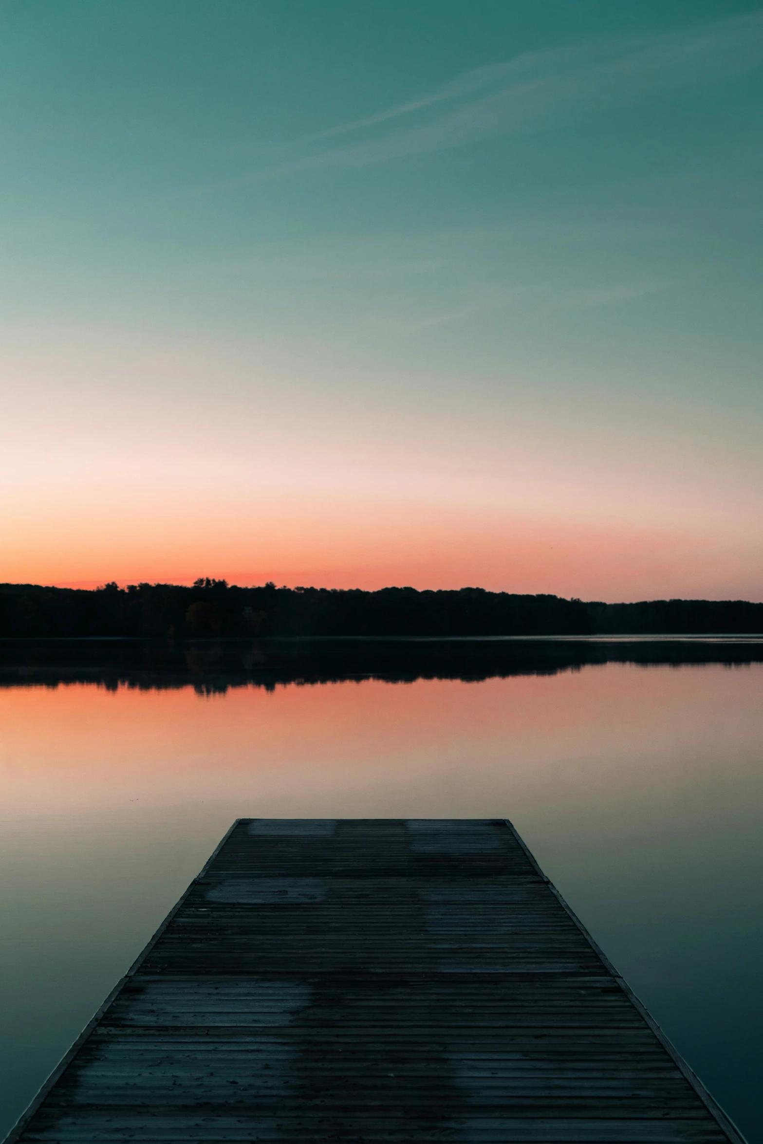 a small dock sitting on top of a large body of water