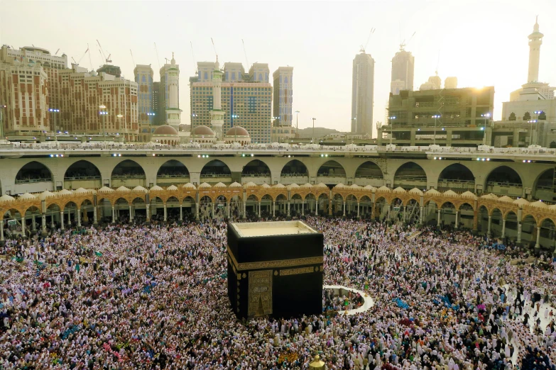 people gathering and praying at the grand mosque in the muslim world