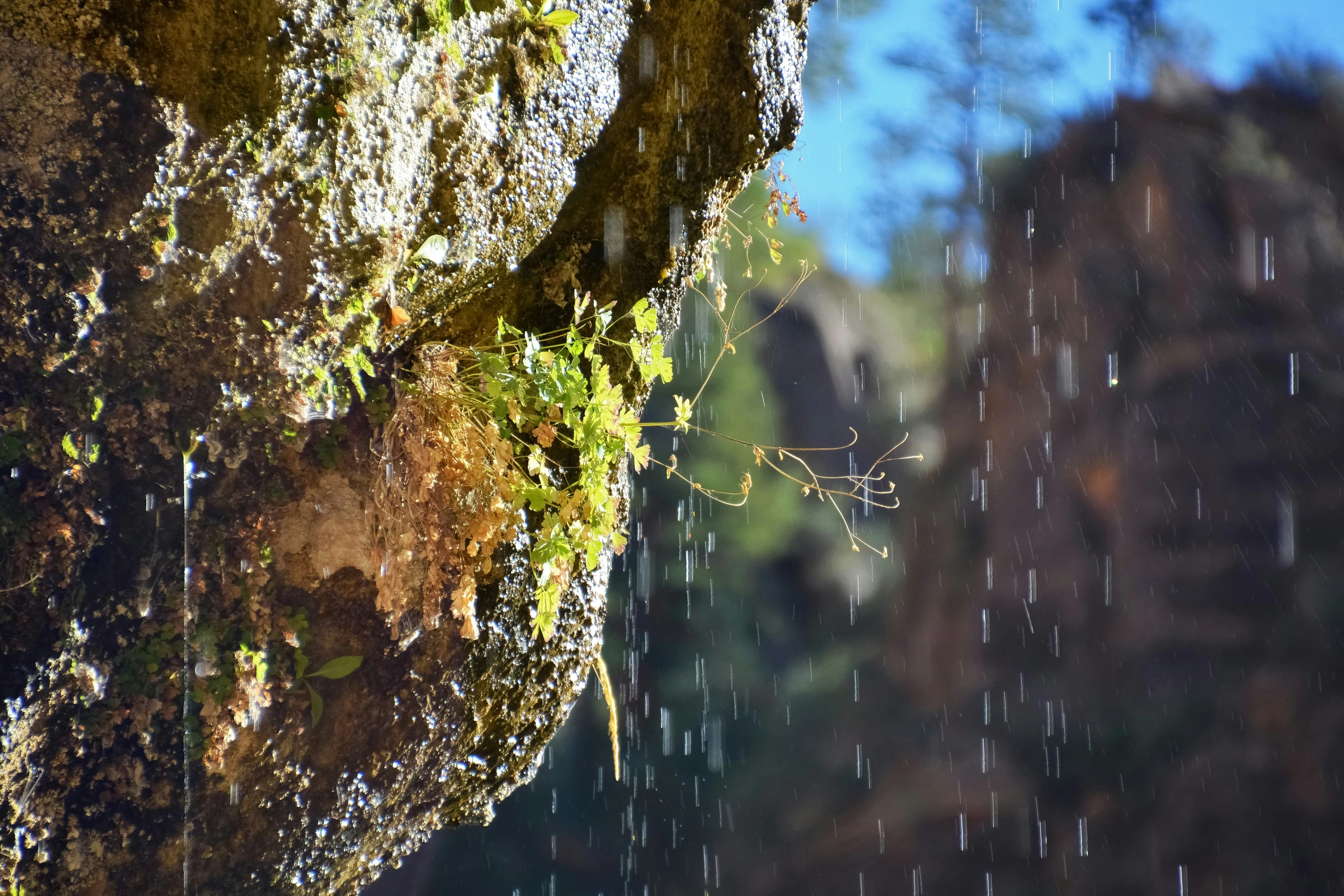 this is a waterfall and some rocks with water