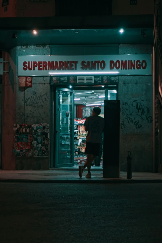 a man walking into a building filled with stuff