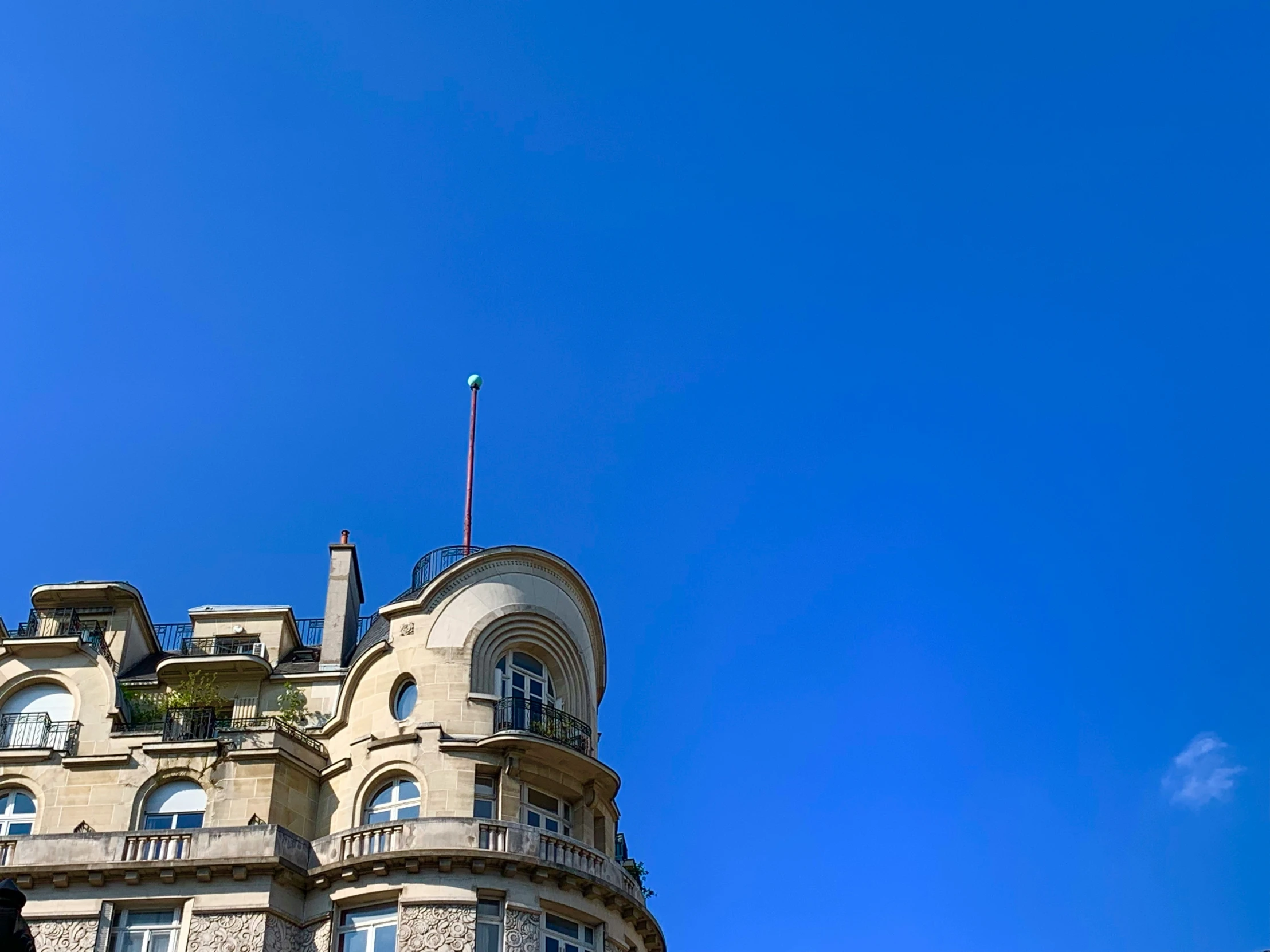 a clock is posted on the front of this old building