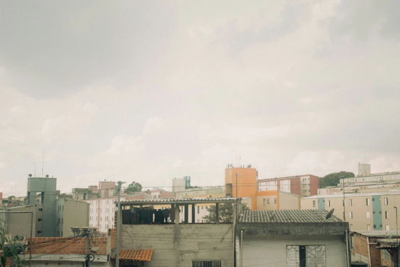 an airplane flying over an old town in the sky