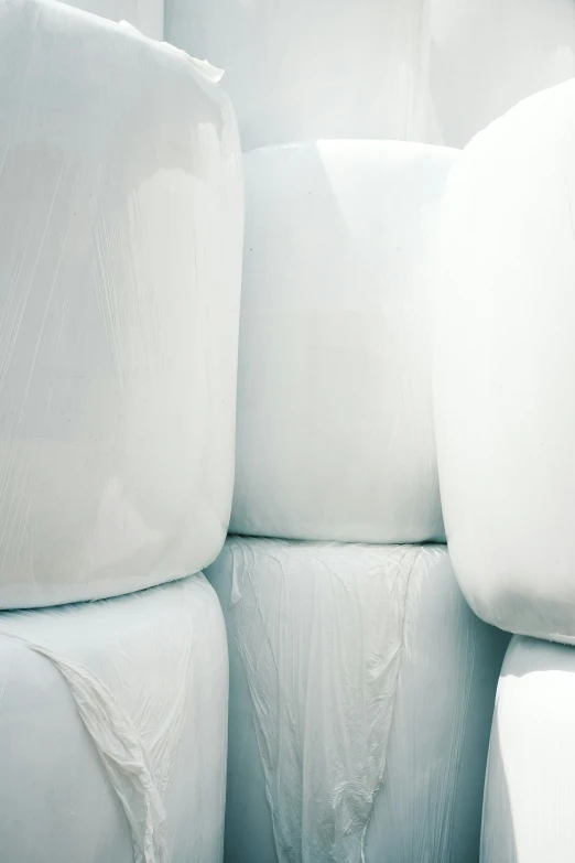 a stack of white sheets made out of foam