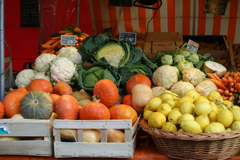 a selection of fruits and vegetables sit on display