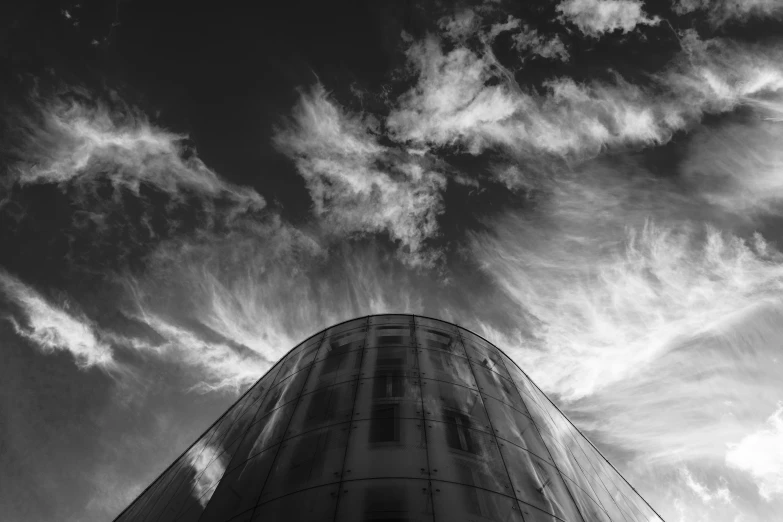 this is the back side of a building under a cloudy sky