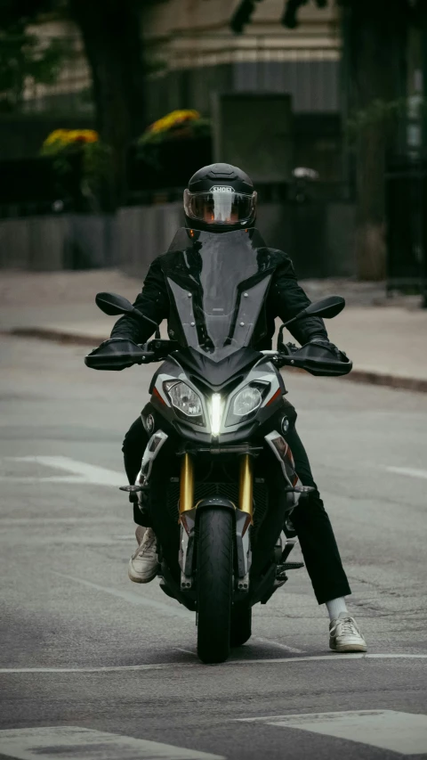 man in black leather jacket and sunglasses on motorcycle