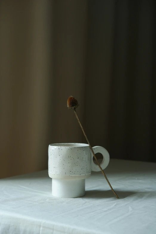 an unusual vase sits on top of the table