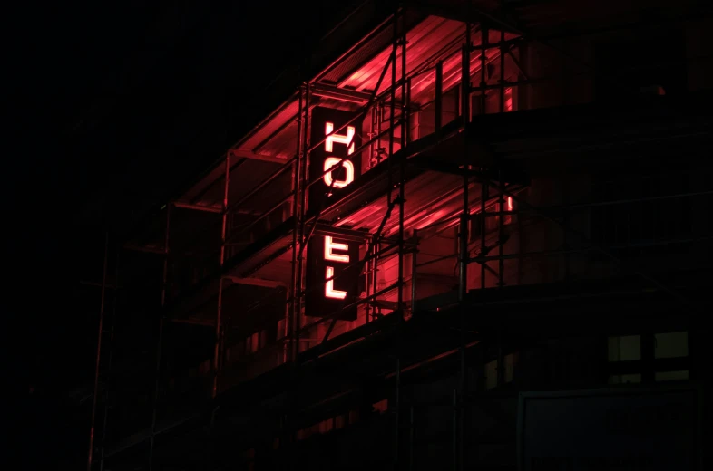 the neon sign reads'motel in the dark