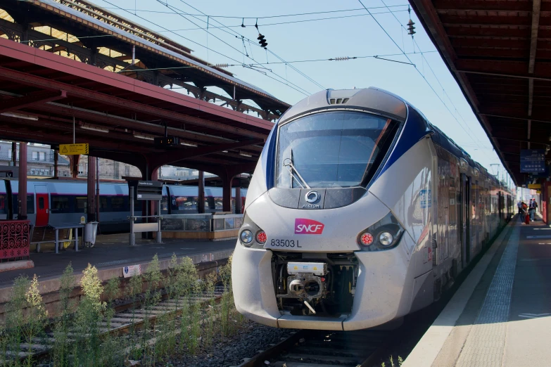 a train that is in the middle of some tracks