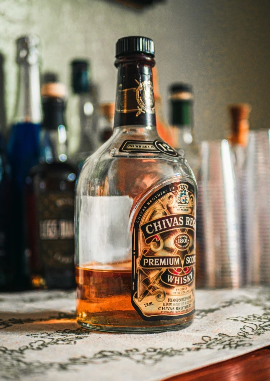 a bottle of whisky sitting on top of a table