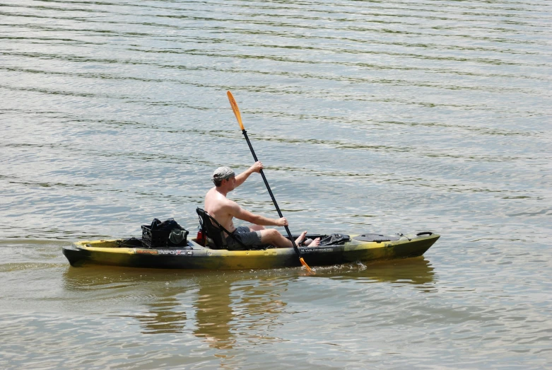 an image of a man in the water on a kayak