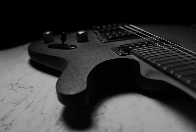 a black and white po of an electric guitar