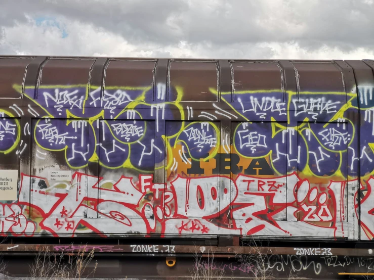 graffiti is on the side of a train car