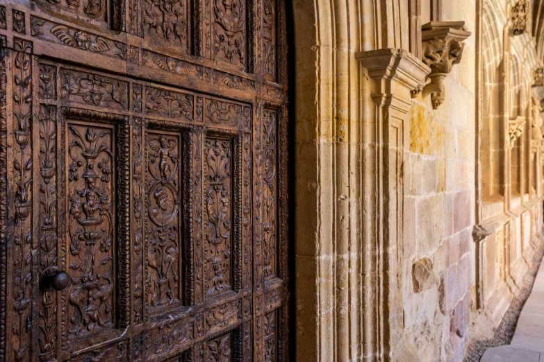 two wooden doors in stone are attached to each other