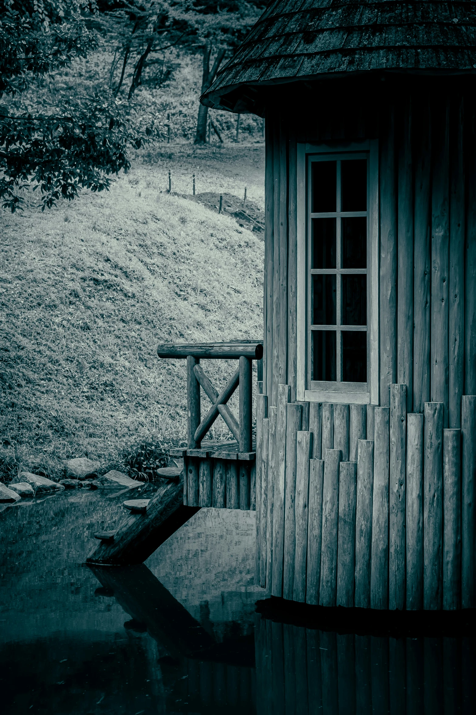 a house sits in the rain on a hillside