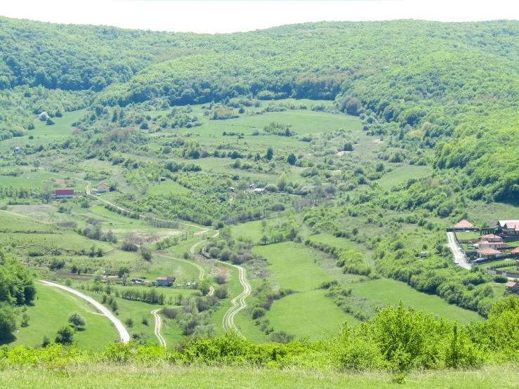 an aerial view of a large green valley