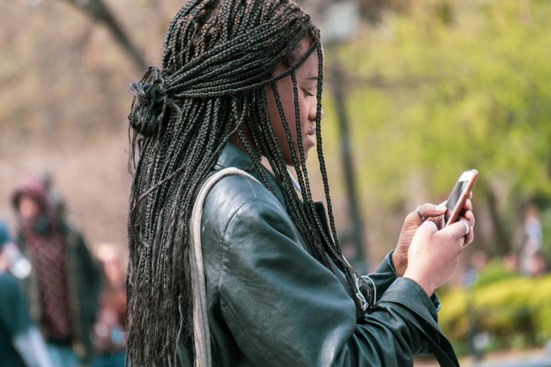 an image of a woman holding her cellphone