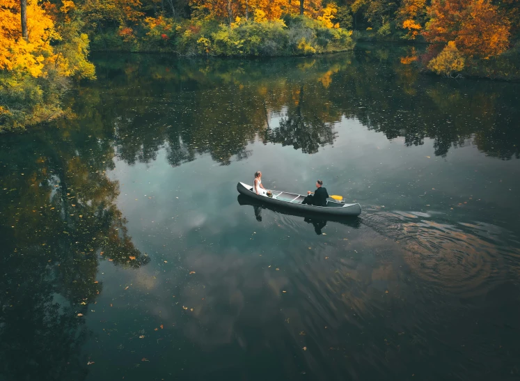 a small boat filled with people on a river