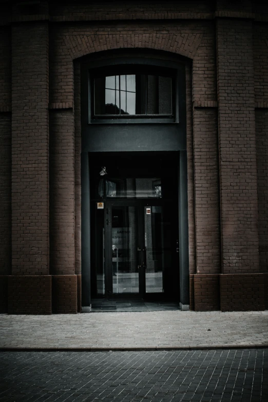 a large brick building with an empty entrance