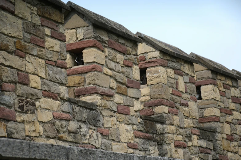 an image of a brick wall that has some bricks cut into it