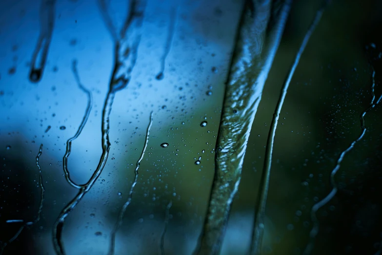 drops of rain on the window glass of a vehicle