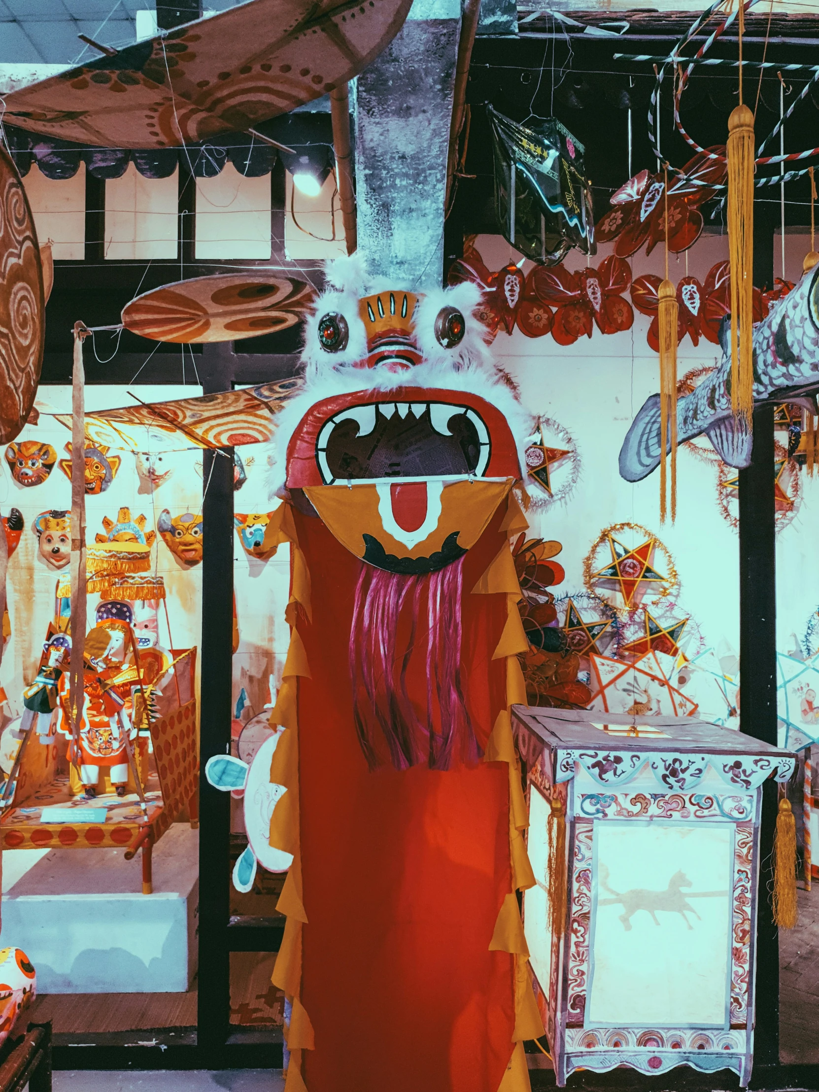 a booth of many colorful items including a puppet