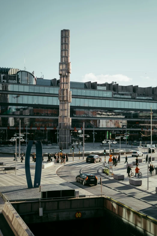 people are walking around a large square in a city