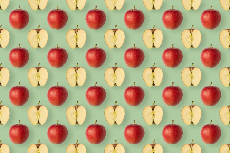 an abstract pattern of red apples and banana slices