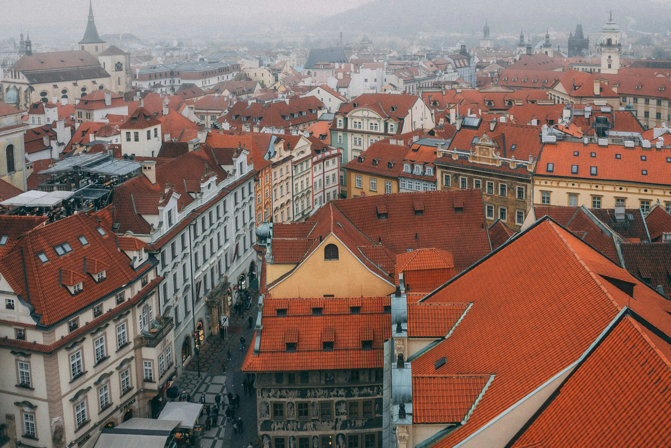 an overhead view of red roofs and city buildings