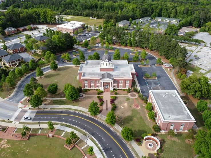 an aerial view of a school with roads in the foreground