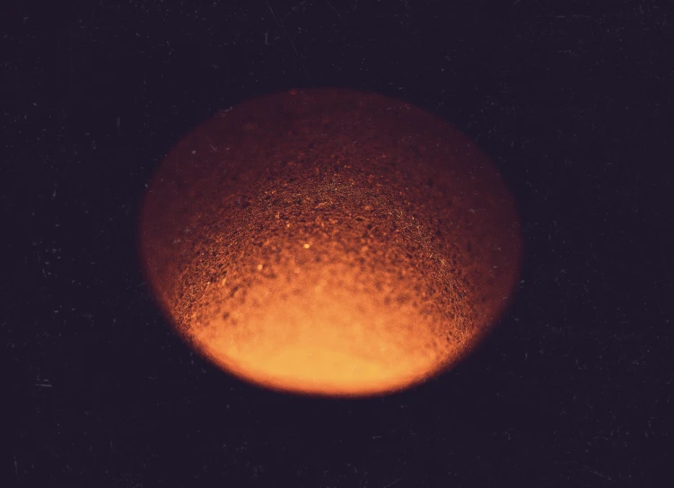 a very large orange substance in the dark