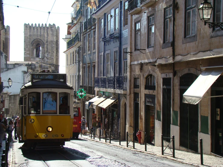 a tram going down an old city street